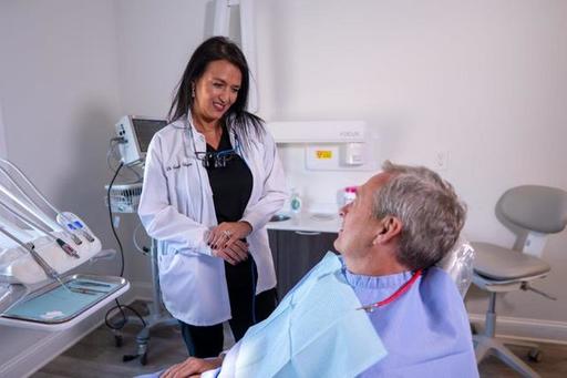 Dr. Sandra Vargas consulting dental patient — cosm